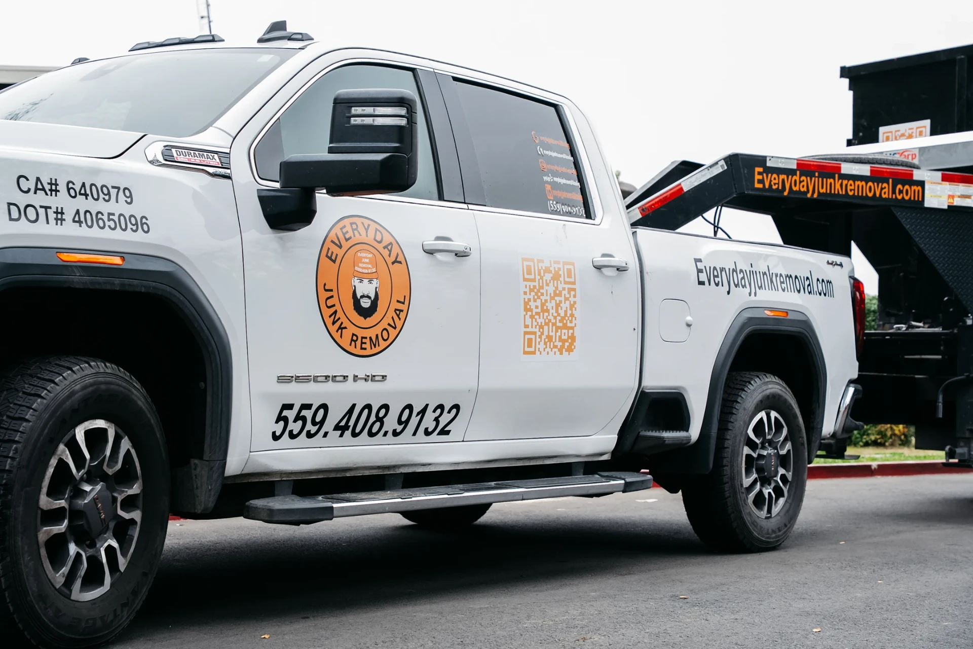 Everyday Junk Removal branded service truck and trailer