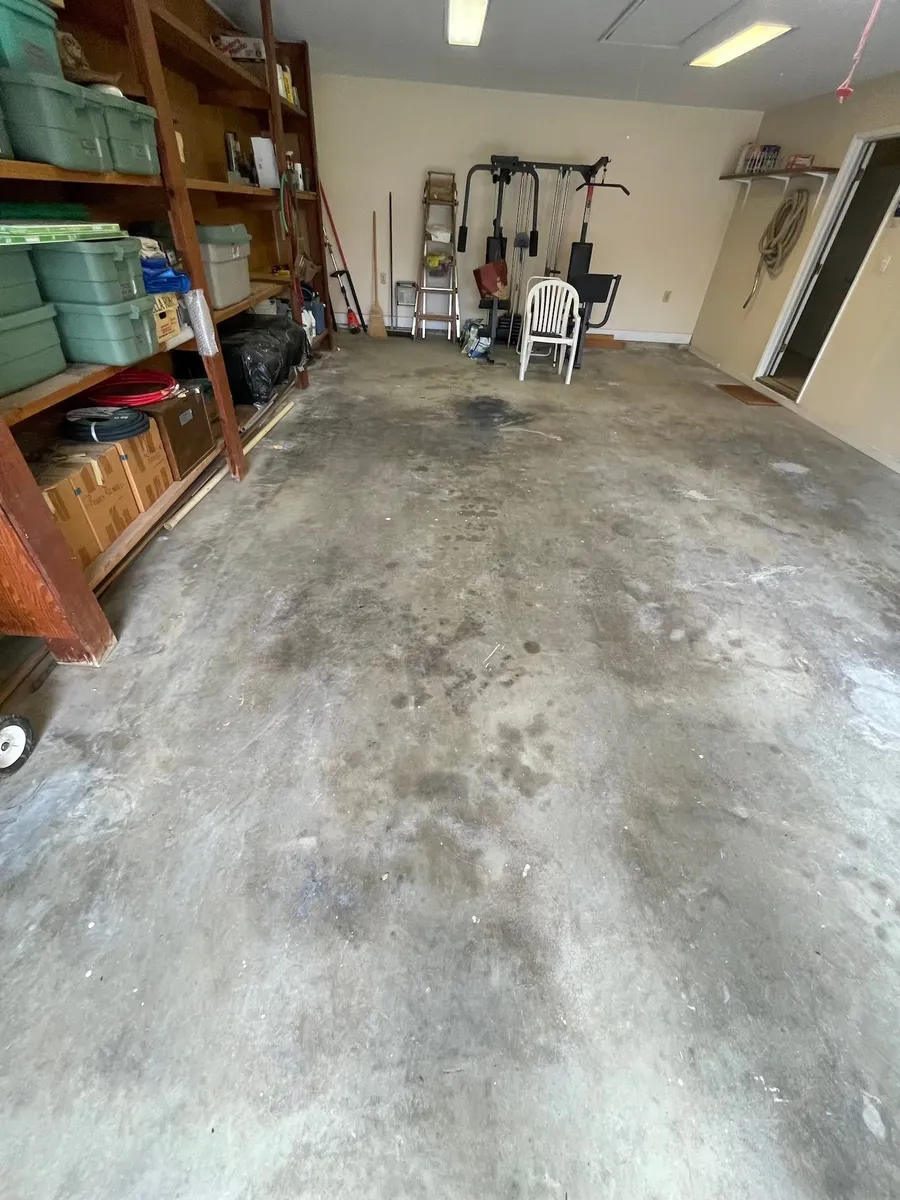 Garage after professional cleanout — fully cleared concrete floor